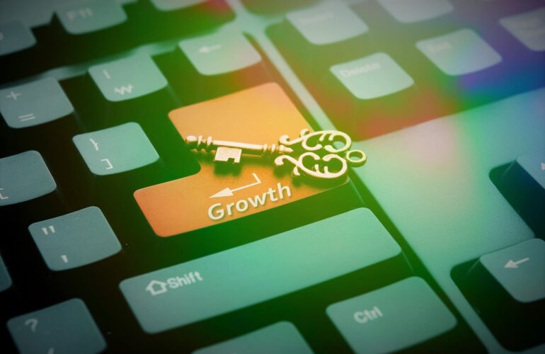 image of a key on top of a keyboard; development opportunities lead to results