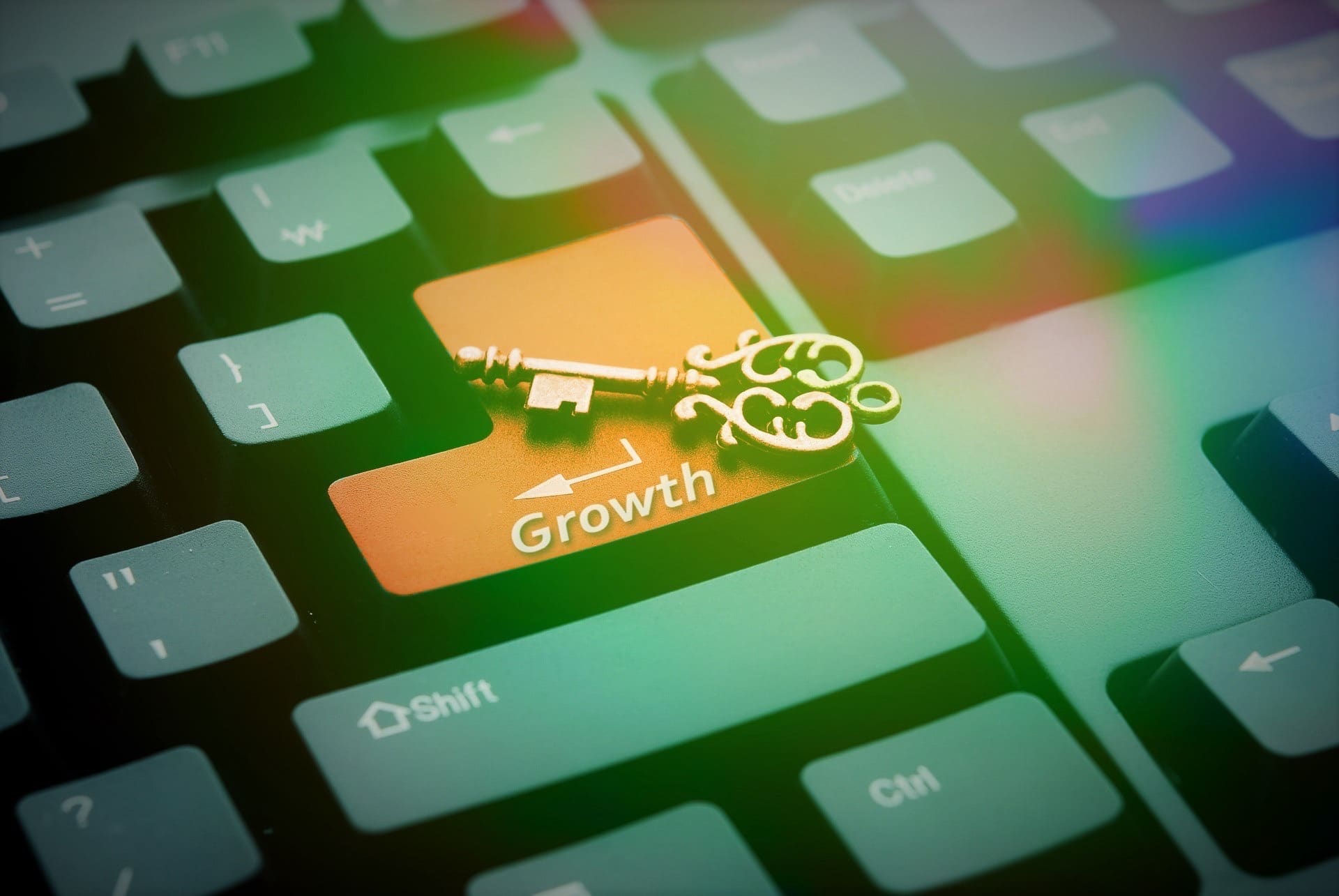 image of a key on top of a keyboard; development opportunities lead to results